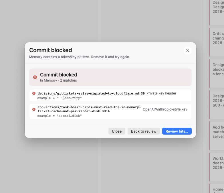 Commit blocked — the secret scan caught a token pattern in TASKS.md with the exact file:line.